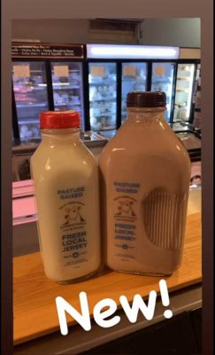 White milk and chocolate milk in glass bottles